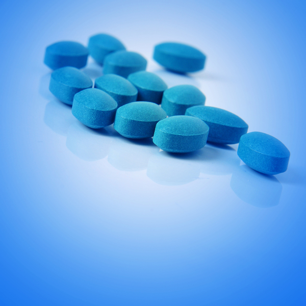Blue viagra pills on a table.